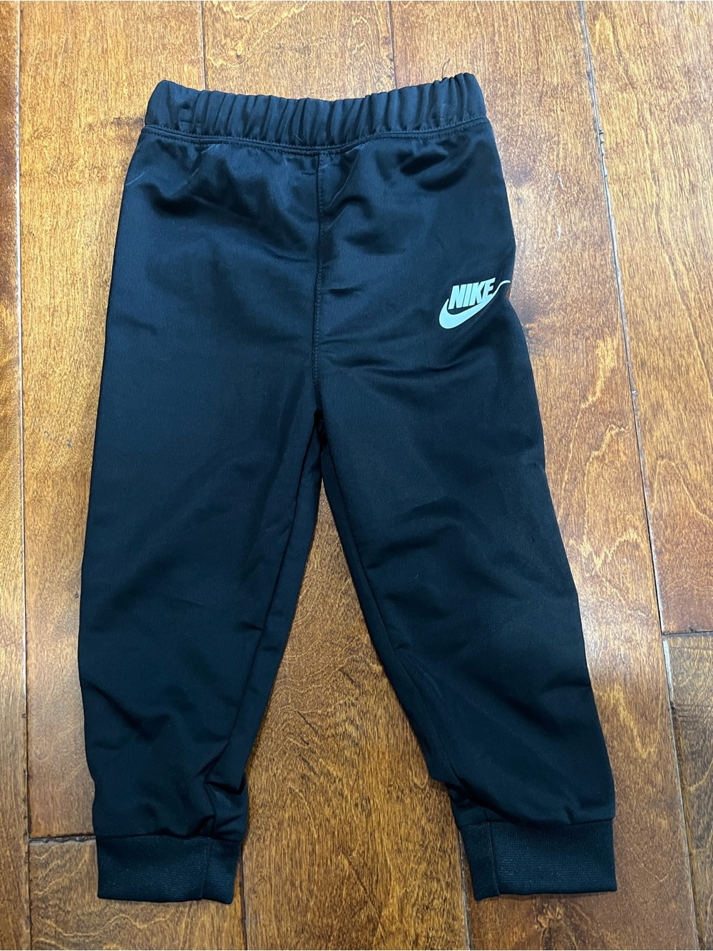 Nike Kids Black Joggers with Mint Logo